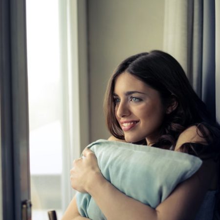 Woman home hug pillow