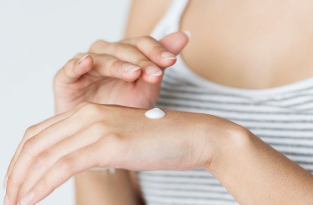 Skincare cream on the back of a hand