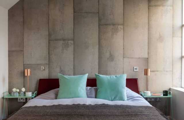 Bedroom with concrete walls