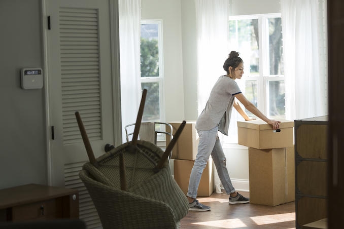Woman moving in boxes