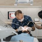 Male dentist in a man's mouth