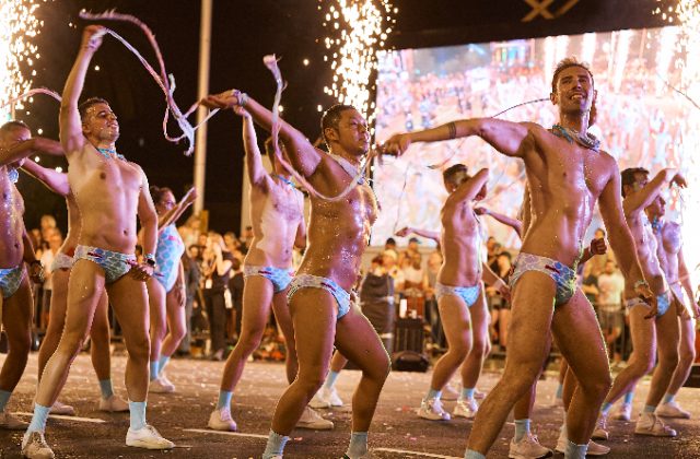 Mardi Gras Parade men topless in speedos