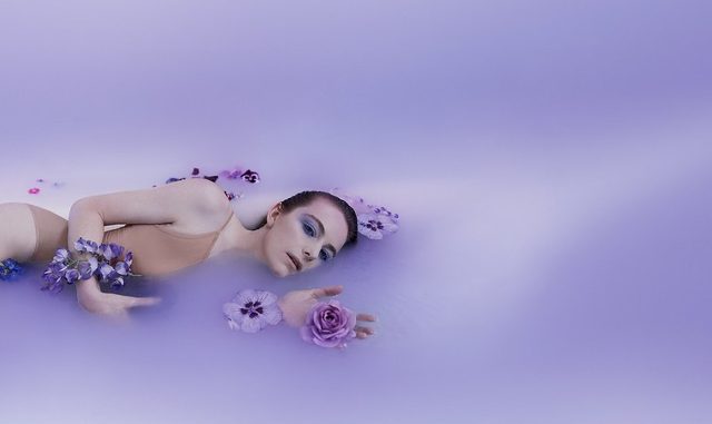 Opera Adriana Lecouvreur woman lying in purple water