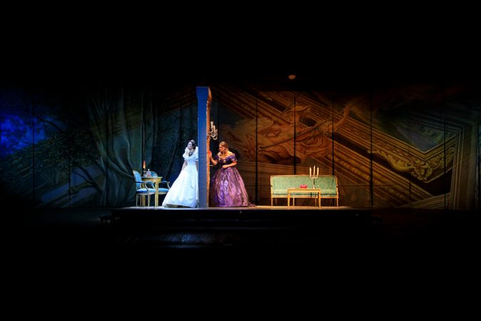Opera Adriana Lecouvreur women on wall stage