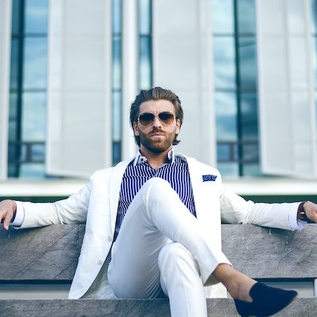 Man white suit bench hair grooming sunglasses