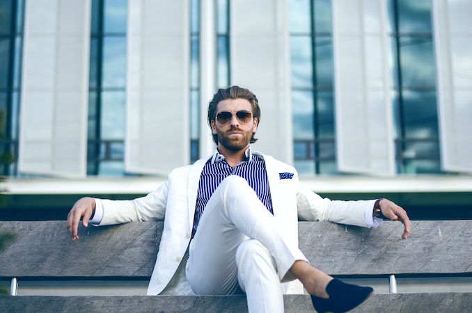 Man white suit bench hair grooming sunglasses