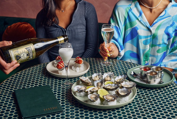 Women table oysters fargo