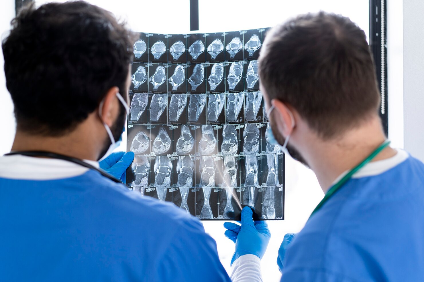 Men doctors looking at scan