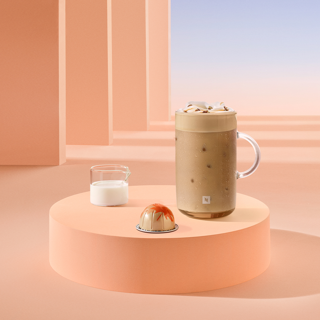 Image of iced coffee in a tall glass with the Nespresso maple and pecan flavour coffee capsule