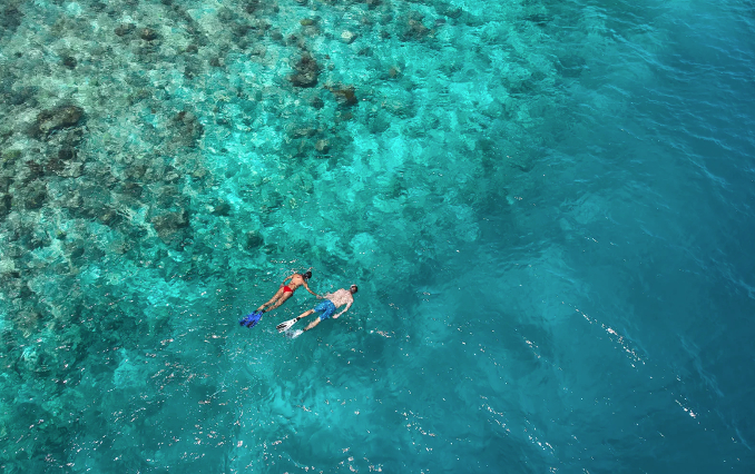 Maldives people swimming hut beach